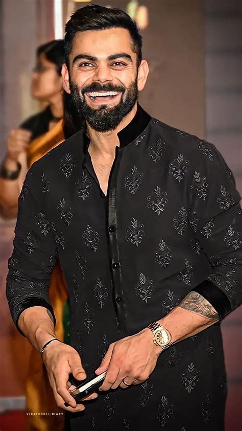 virat kohli in black suit.